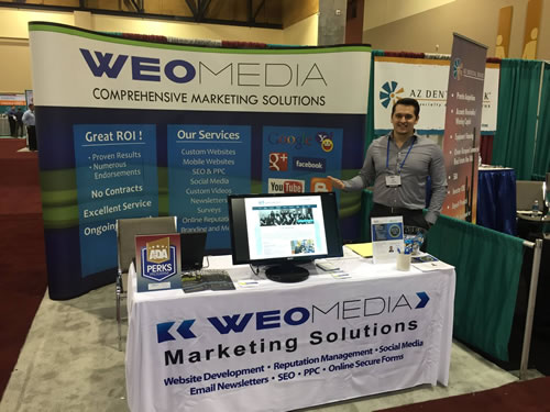 WEO Media booth with Joe Genco. He can connect you with an expert in local SEO for dentists.